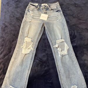 Brand new with tags. Brand- Lovevet. Medium wash, distressed size 5/27